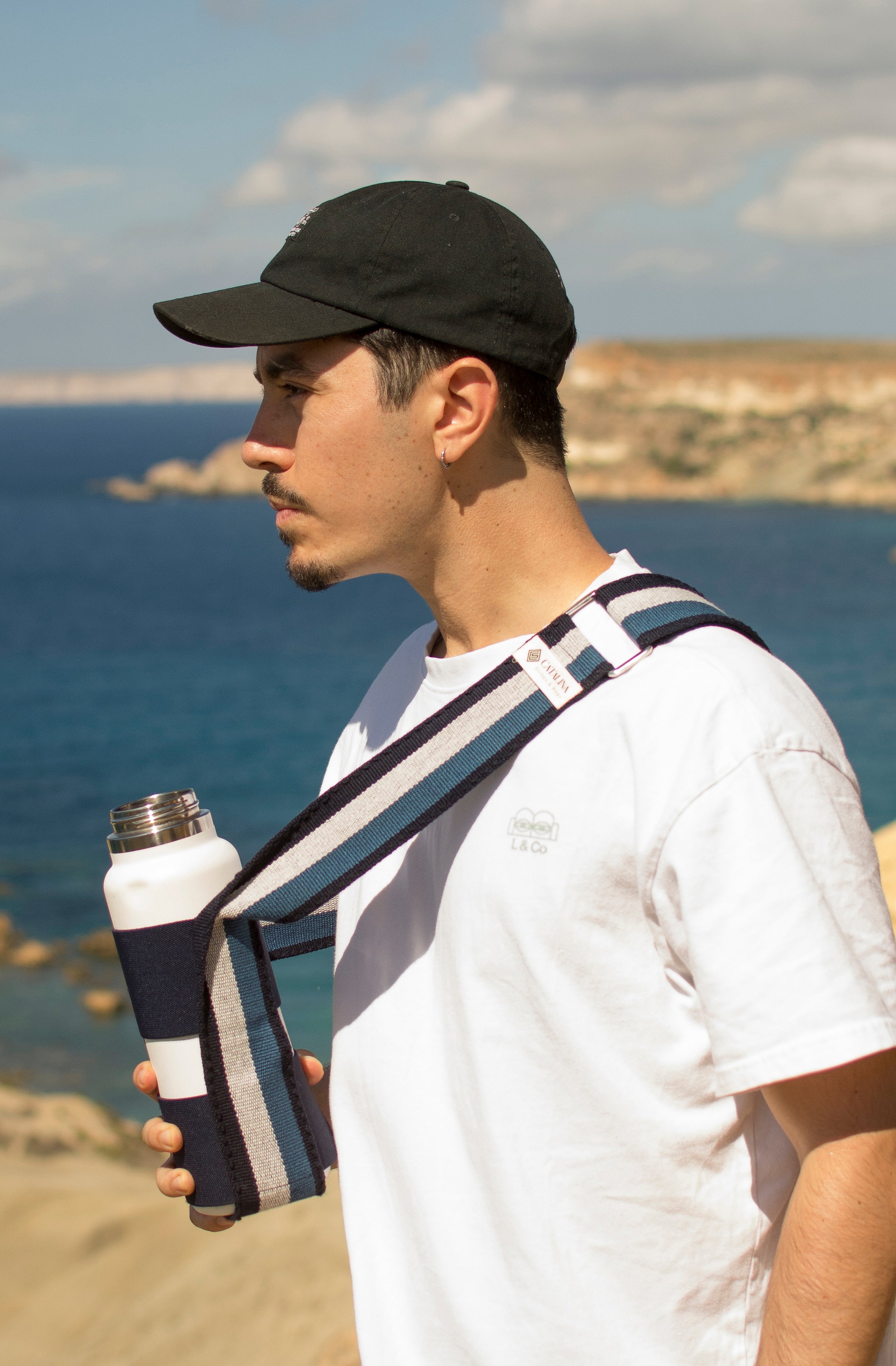 a man holding his drink bottle