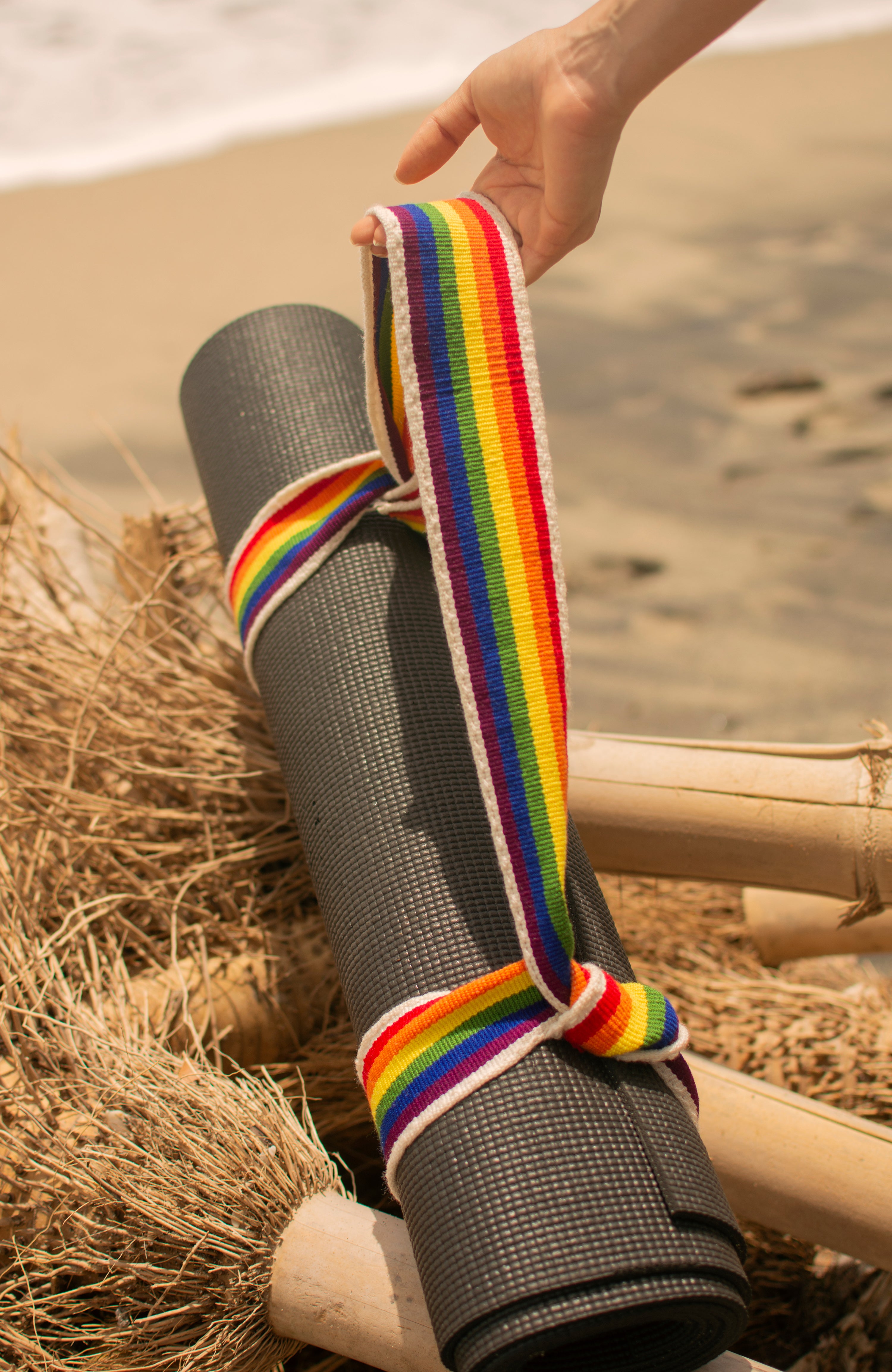 Close up of the Pride Yoga strap and Yoga mat